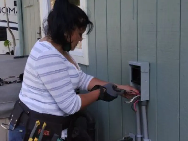 Licensed electrician wiring an exterior subpanel in Old Lycoming